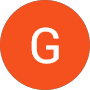 Orange circle with white letter G